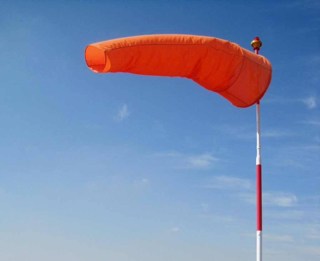 windsock, bright, orange, blue sky, air sleeve, air sock, wind cone, red, white, pole, wind, blowing, windsock, windsock, windsock, windsock, windsock